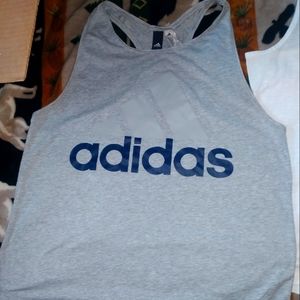 Adidas size lrg women's tank top grey in color.